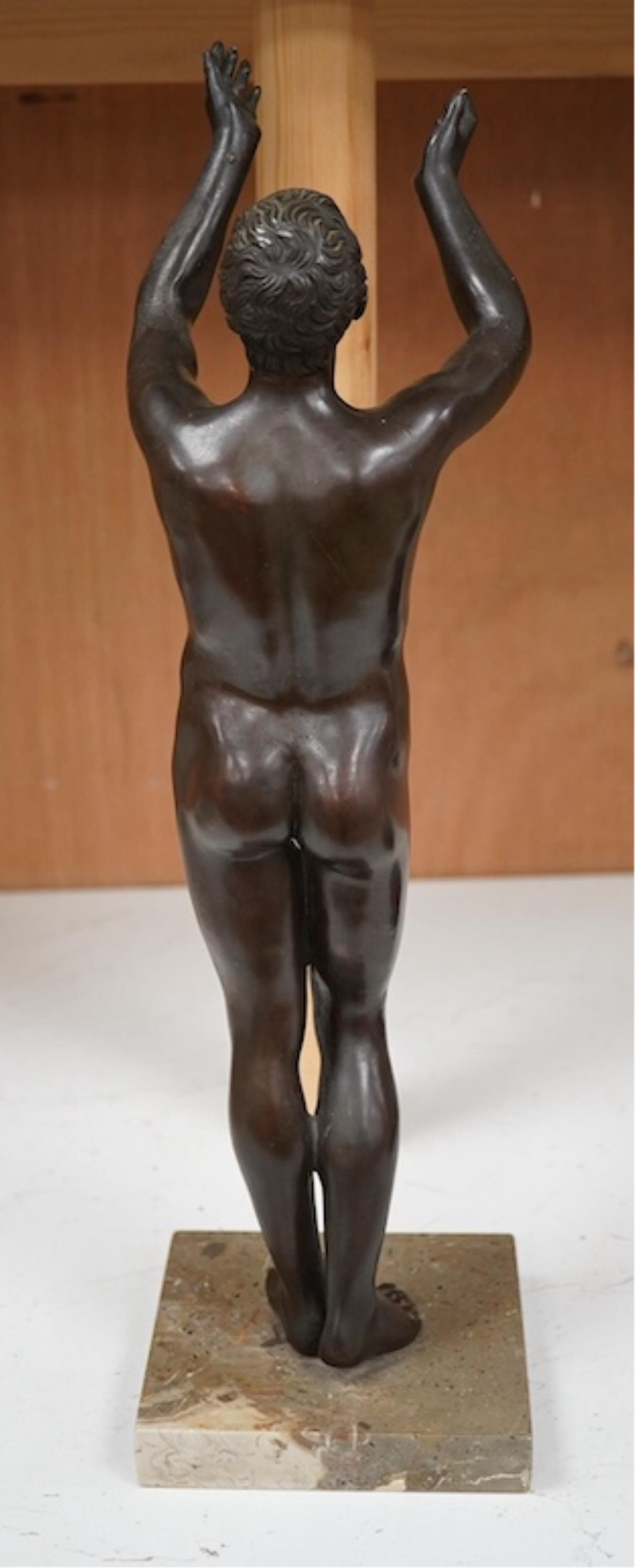 A patinated bronze figure, after the antique ‘The Praying Boy’. 42cm high. Condition - good